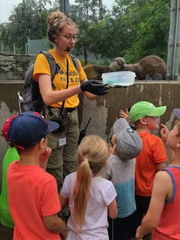 RPZ educator speaking to a group of children at the otter exhibit