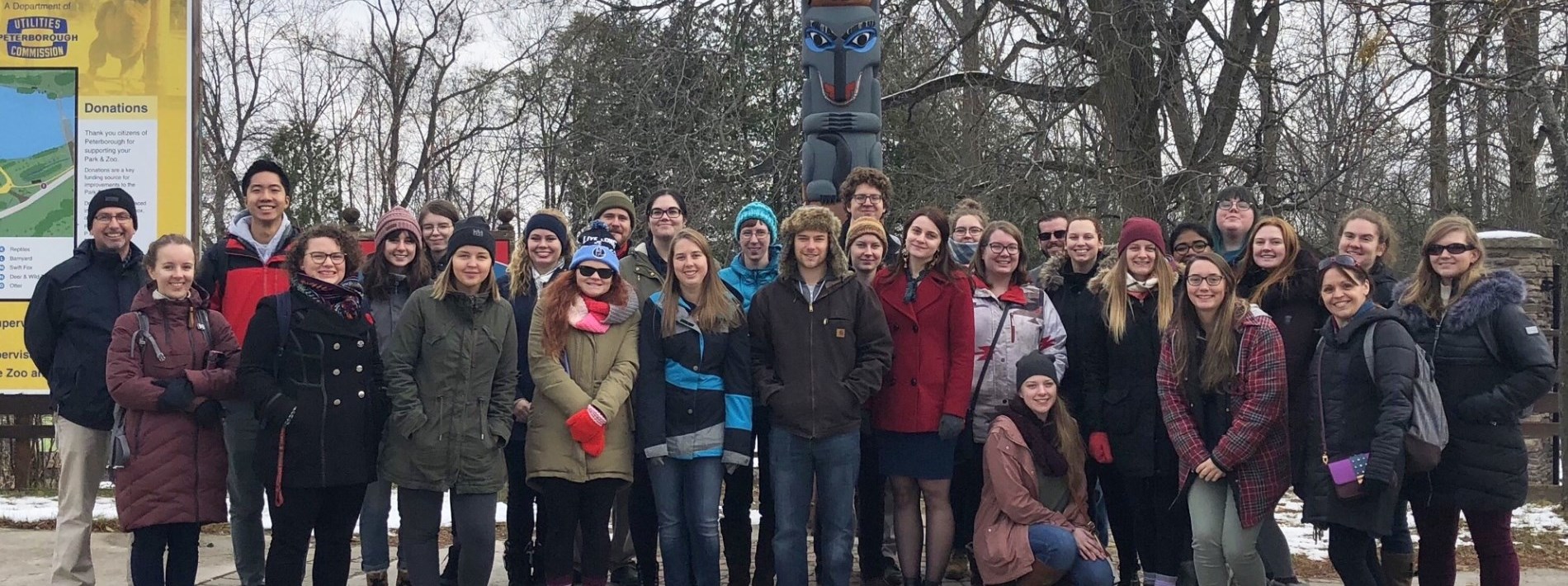 group tour standing outside of the Park and Zoo entrance