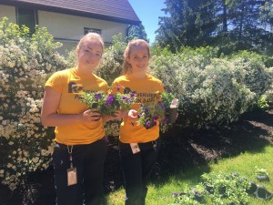 Zoo staff holding flowers