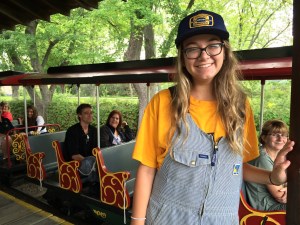 train conductor student standing in front of the train