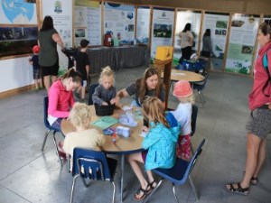 kids making crafts at small round table in dobbin buiding