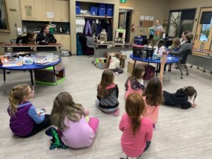 enrichment class and instructor holding up a bunny box