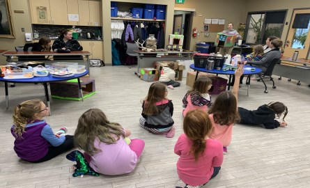 workshop for guides with kids on floor watching instructor