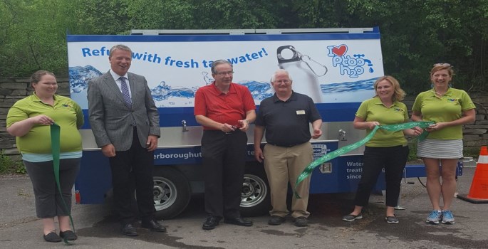water wagon ribbon cutting with the MP and committee