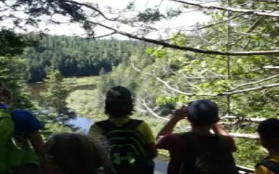 Warsaw cave scenery in summer with kids looking out