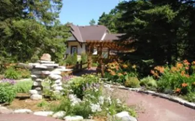 Office garden in bloom with inukshuk structure