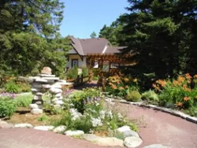 Office garden in bloom with inukshuk structure